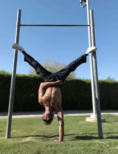 Chris Brandlin doing a handstand in the park