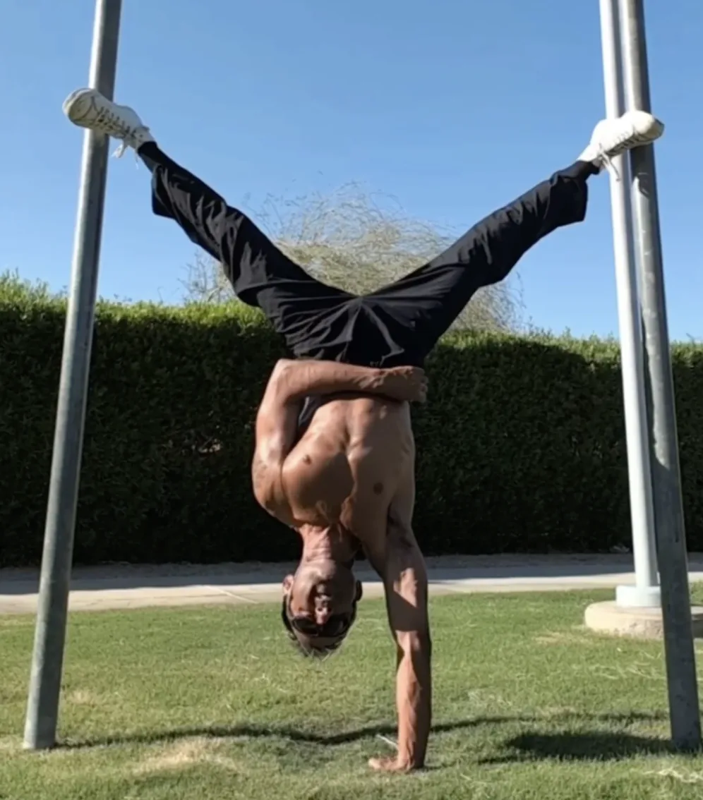 Chris Brandlin doing a handstand in the park